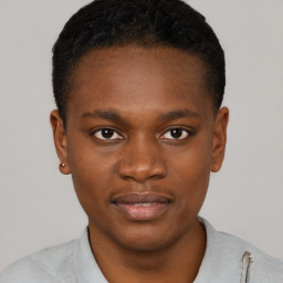 Joyful black young-adult male with short  brown hair and brown eyes