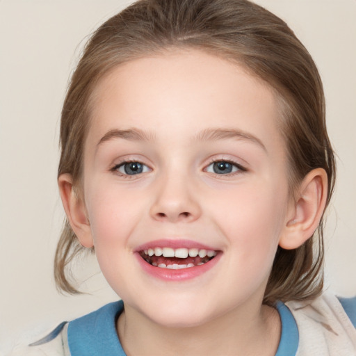 Joyful white child female with medium  brown hair and blue eyes