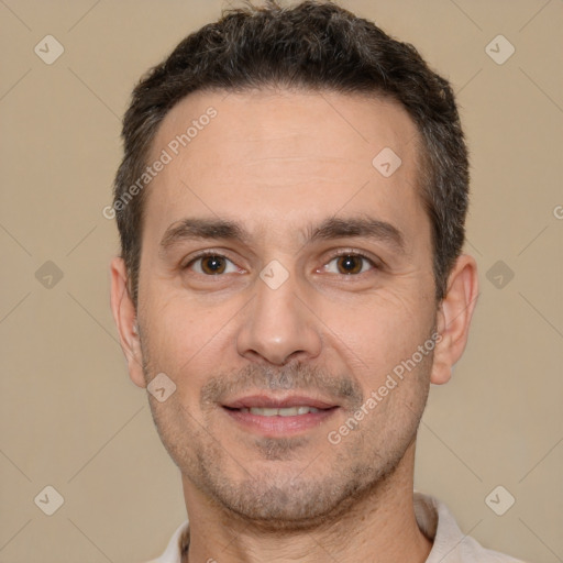 Joyful white adult male with short  brown hair and brown eyes