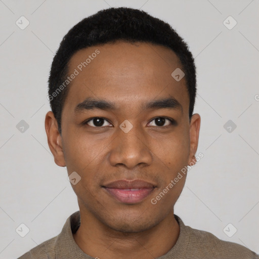 Joyful black young-adult male with short  black hair and brown eyes