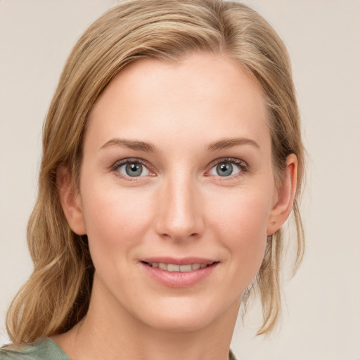 Joyful white young-adult female with medium  brown hair and blue eyes