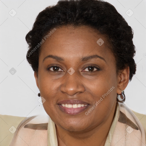 Joyful black adult female with short  brown hair and brown eyes