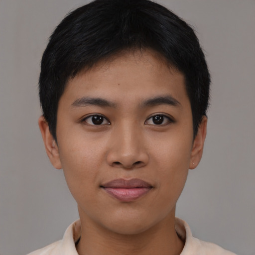 Joyful asian young-adult female with short  black hair and brown eyes