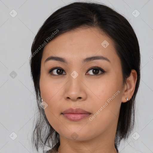 Joyful asian young-adult female with medium  brown hair and brown eyes