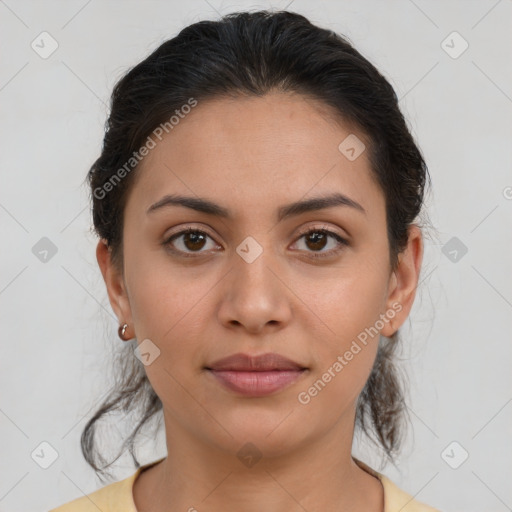 Joyful latino young-adult female with medium  brown hair and brown eyes