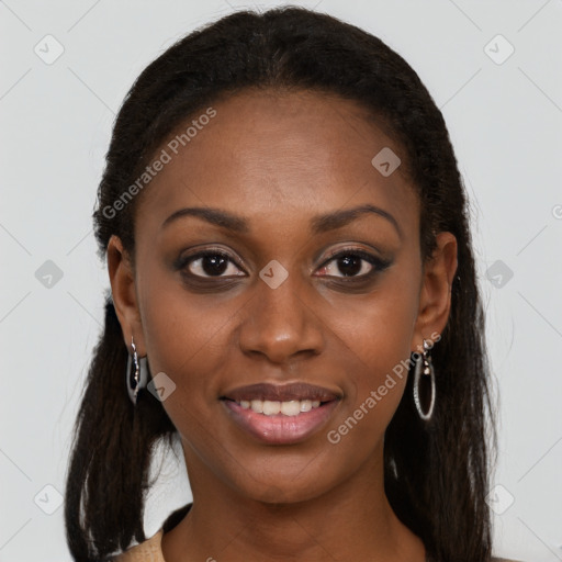 Joyful black young-adult female with long  brown hair and brown eyes