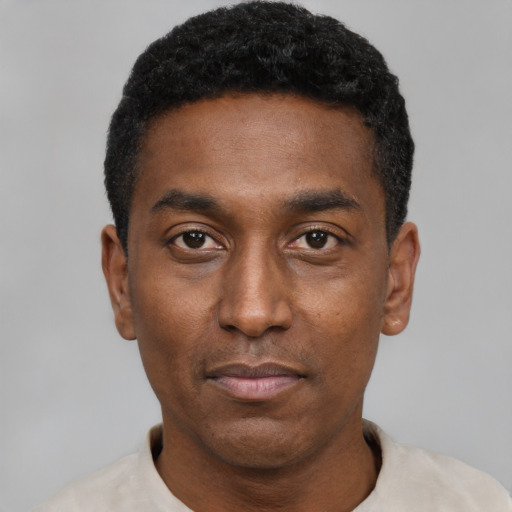 Neutral black young-adult male with short  black hair and brown eyes