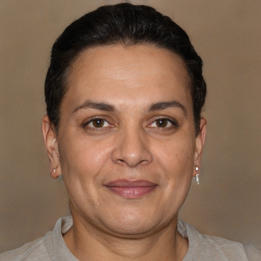 Joyful white adult female with short  brown hair and brown eyes