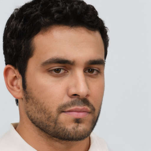 Neutral white young-adult male with short  black hair and brown eyes