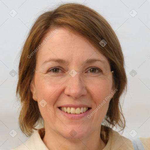 Joyful white adult female with medium  brown hair and blue eyes