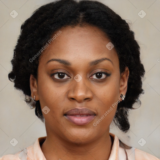 Joyful black young-adult female with medium  black hair and brown eyes