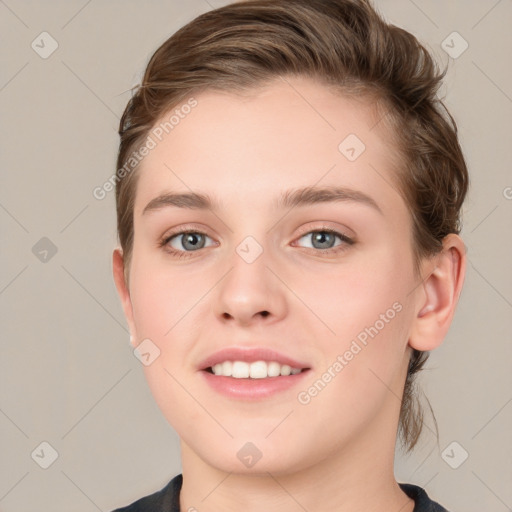 Joyful white young-adult female with medium  brown hair and grey eyes