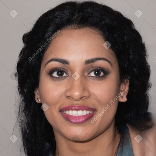 Joyful black young-adult female with long  black hair and brown eyes