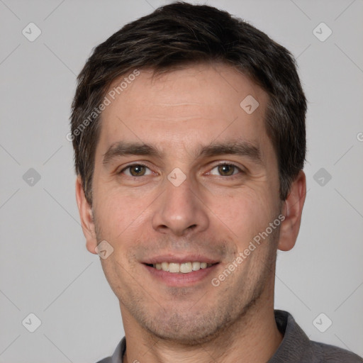 Joyful white adult male with short  brown hair and brown eyes