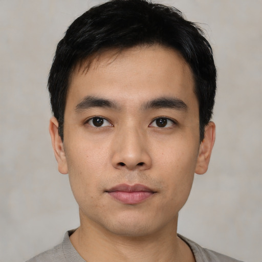 Neutral asian young-adult male with short  black hair and brown eyes