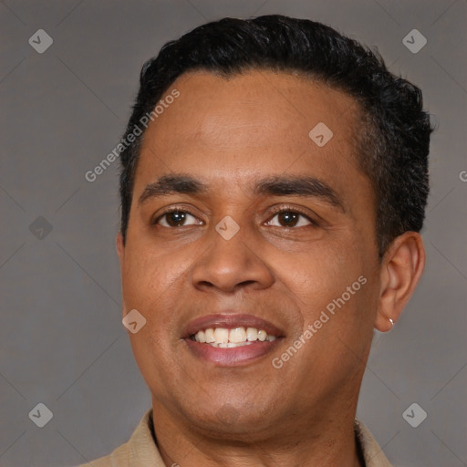 Joyful latino young-adult male with short  black hair and brown eyes