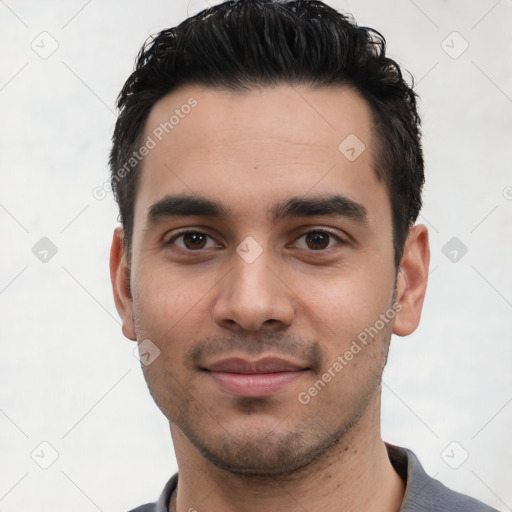 Joyful white young-adult male with short  black hair and brown eyes