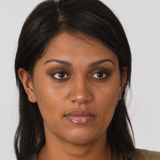 Neutral black young-adult female with long  brown hair and brown eyes