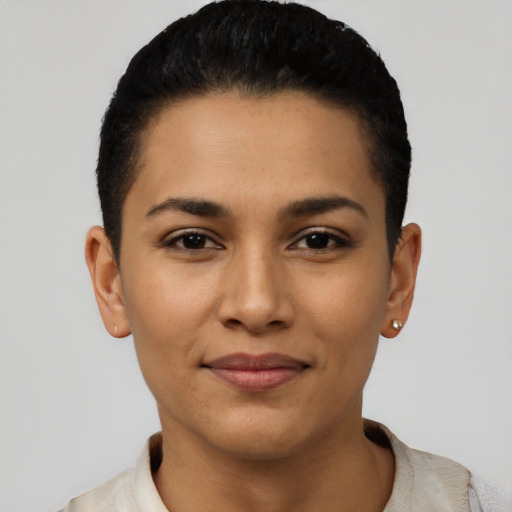 Joyful latino young-adult female with short  black hair and brown eyes