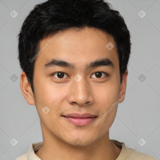 Joyful asian young-adult male with short  black hair and brown eyes