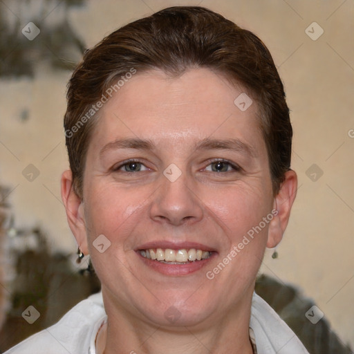 Joyful white adult female with short  brown hair and brown eyes