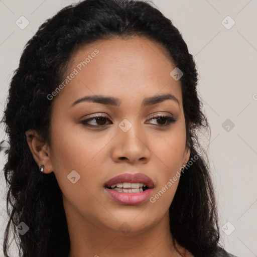 Joyful latino young-adult female with long  black hair and brown eyes