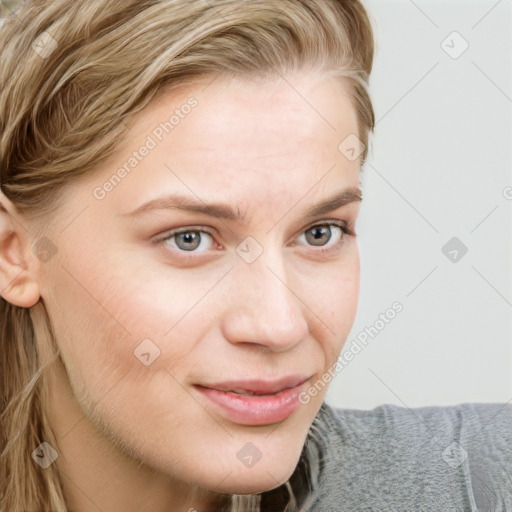 Joyful white young-adult female with long  brown hair and blue eyes