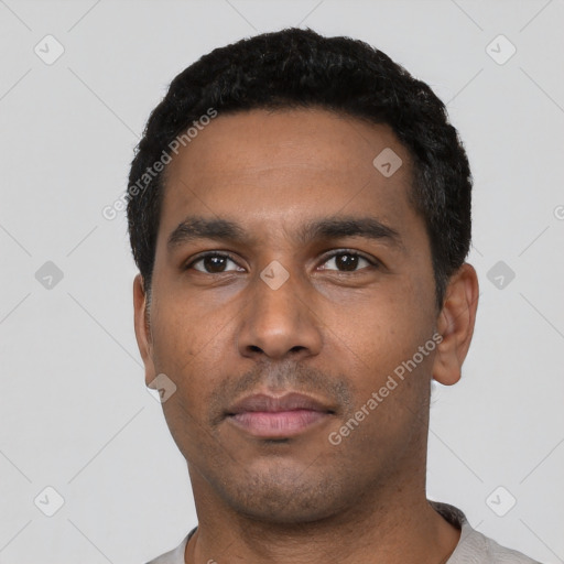 Neutral latino young-adult male with short  black hair and brown eyes