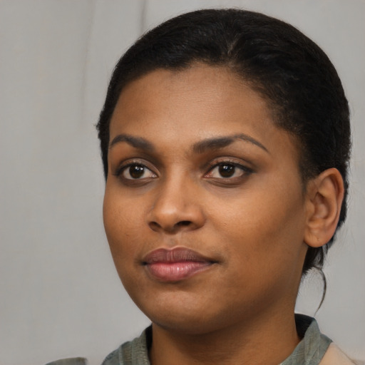 Neutral black young-adult female with medium  black hair and brown eyes