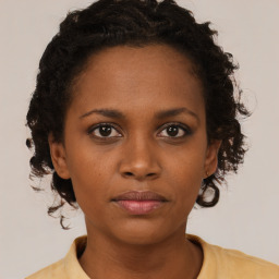 Neutral black young-adult female with short  brown hair and brown eyes