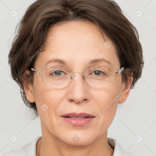 Joyful white adult female with short  brown hair and grey eyes