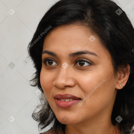 Joyful latino young-adult female with long  brown hair and brown eyes