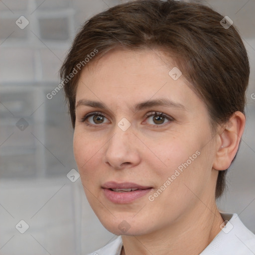 Joyful white adult female with short  brown hair and brown eyes