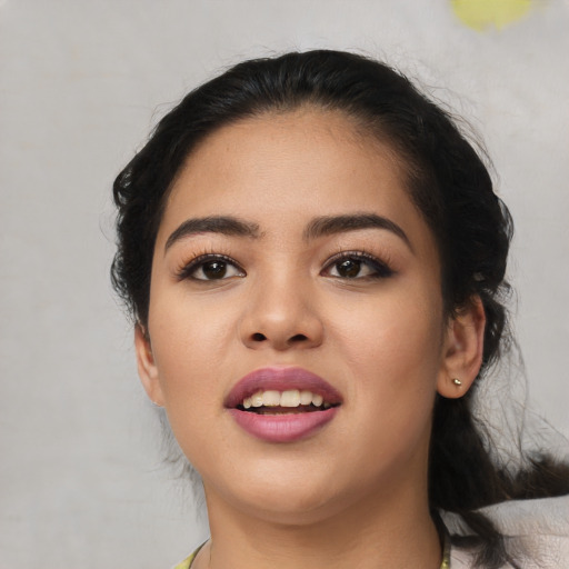 Joyful latino young-adult female with medium  black hair and brown eyes