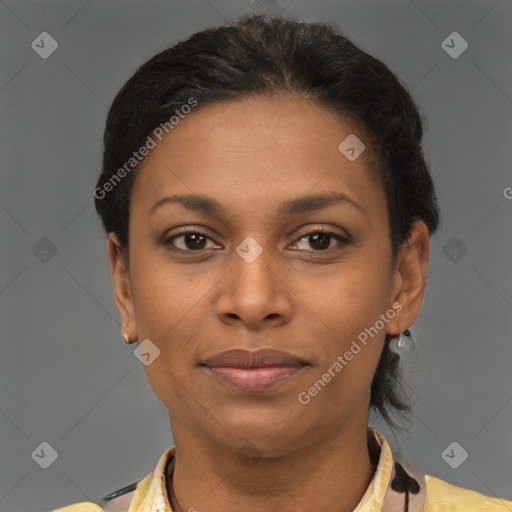 Joyful latino young-adult female with short  brown hair and brown eyes