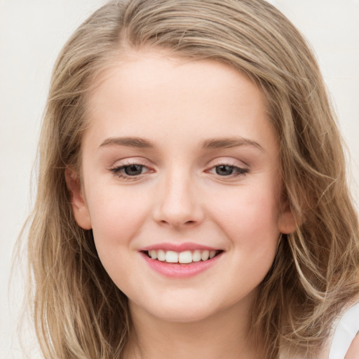 Joyful white young-adult female with long  brown hair and blue eyes