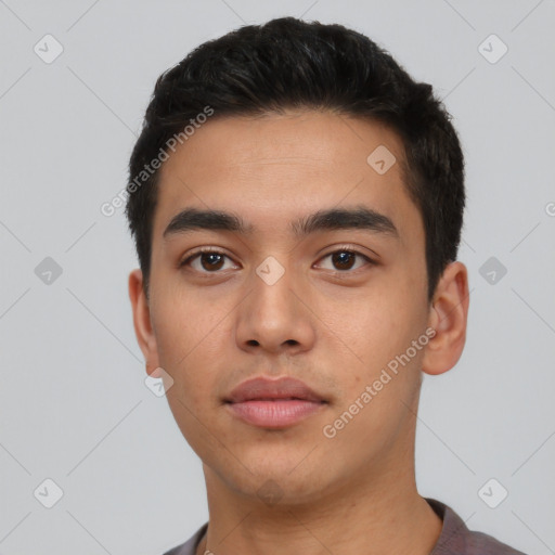 Neutral latino young-adult male with short  black hair and brown eyes