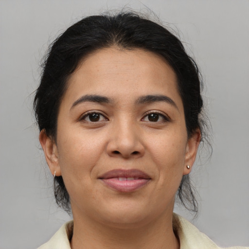 Joyful asian young-adult female with medium  brown hair and brown eyes