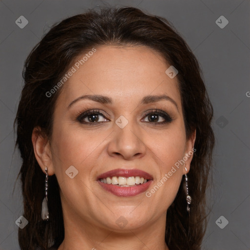 Joyful white adult female with long  brown hair and brown eyes