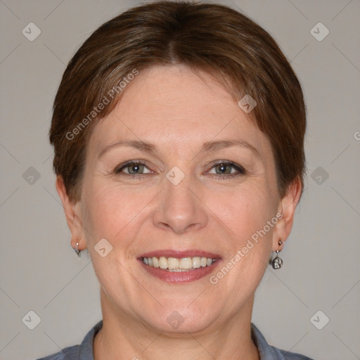 Joyful white adult female with short  brown hair and grey eyes