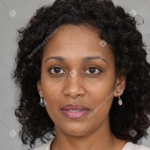 Joyful black young-adult female with medium  brown hair and brown eyes