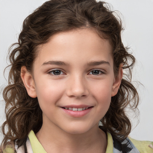 Joyful white child female with medium  brown hair and brown eyes