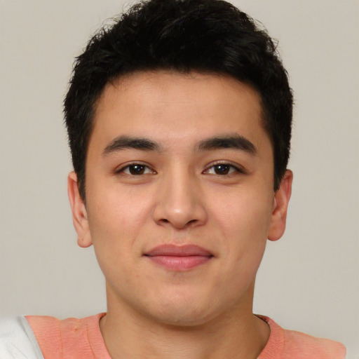 Joyful asian young-adult male with short  black hair and brown eyes