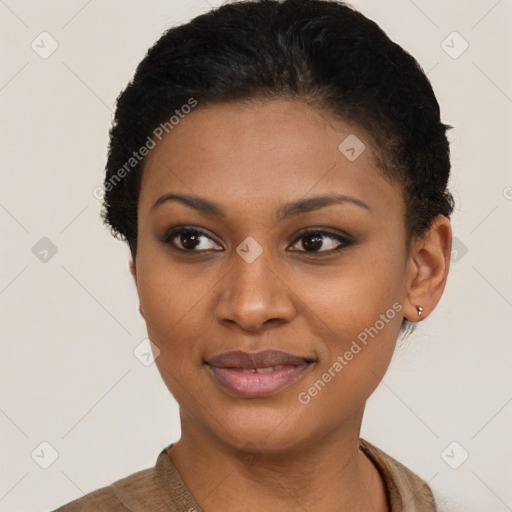 Joyful black young-adult female with short  black hair and brown eyes