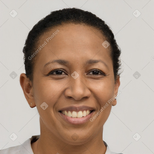 Joyful black young-adult female with short  brown hair and brown eyes