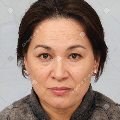 Joyful white adult female with medium  brown hair and brown eyes