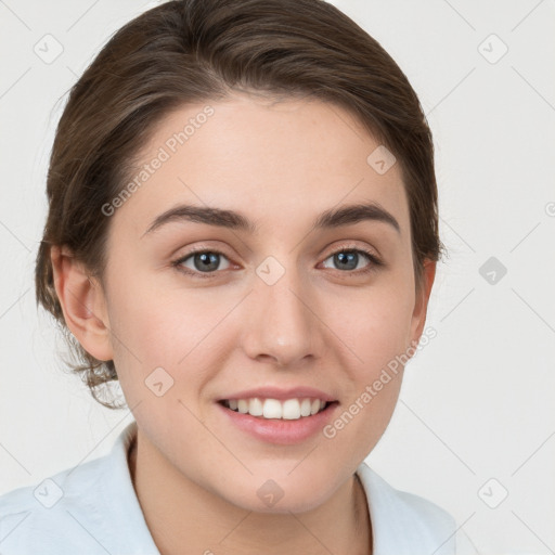 Joyful white young-adult female with medium  brown hair and grey eyes