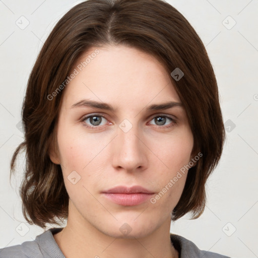 Neutral white young-adult female with medium  brown hair and grey eyes