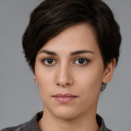 Neutral white young-adult female with medium  brown hair and brown eyes