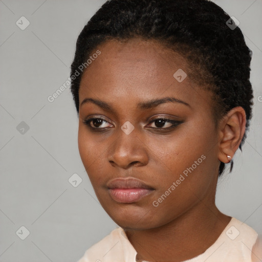 Neutral black young-adult female with short  black hair and brown eyes